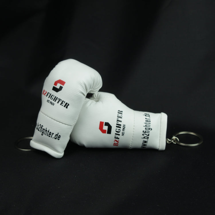 Mini-Boxhandschuh-Schlüsselanhänger, weißer Handschuh mit Ring und Logo an der Seite