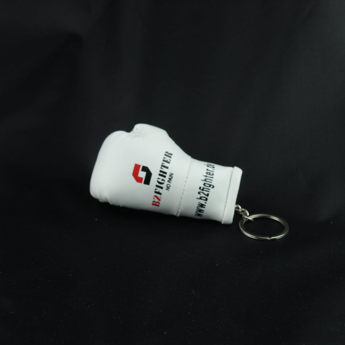 Mini-Boxhandschuh-Schlüsselanhänger, weißer Handschuh seitlich mit Ring